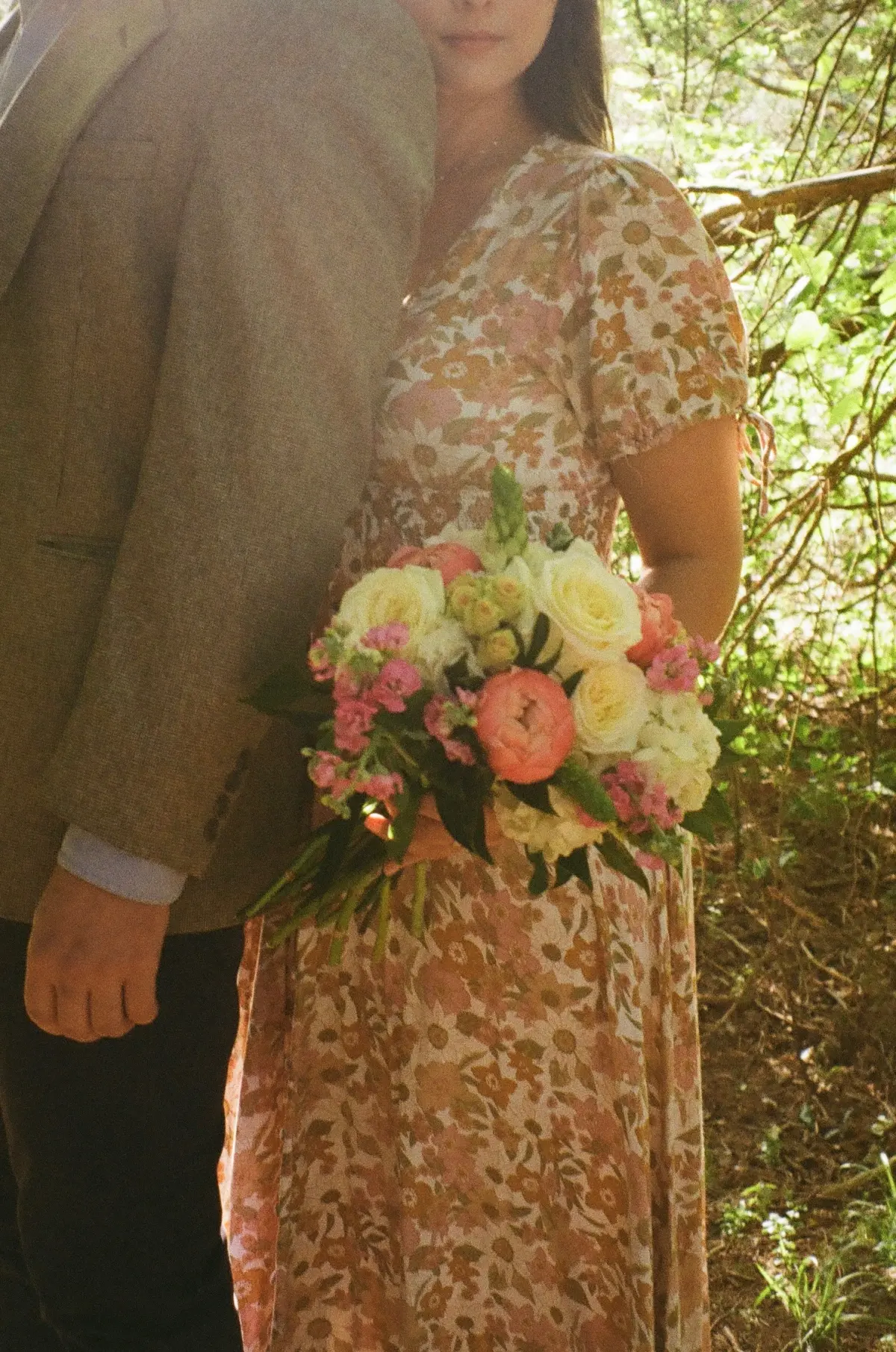 A bride holding a Wedding Box Florals bouquet