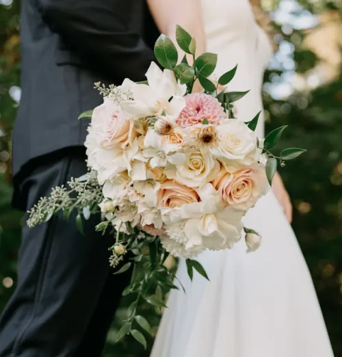 Garden-style bridal bouquet with white roses and eucalyptus — real wedding