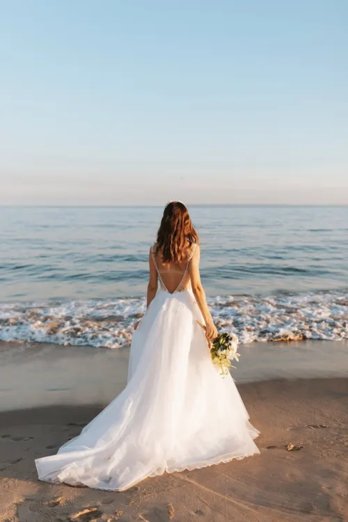 Bride holding a whimsical wildflower bouquet on her wedding day