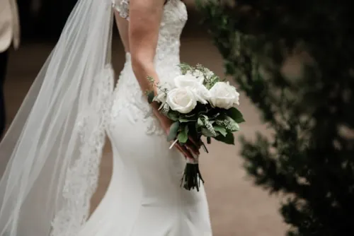 Modern bridal bouquet with pink peonies and greenery