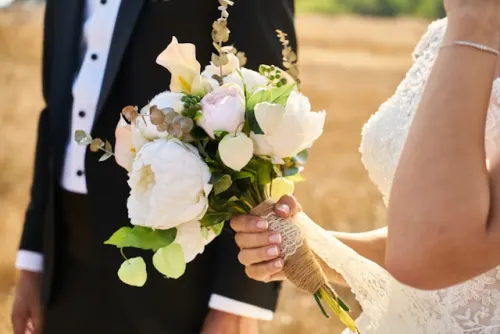 Close-up of a pre-assembled wedding bouquet with blush roses