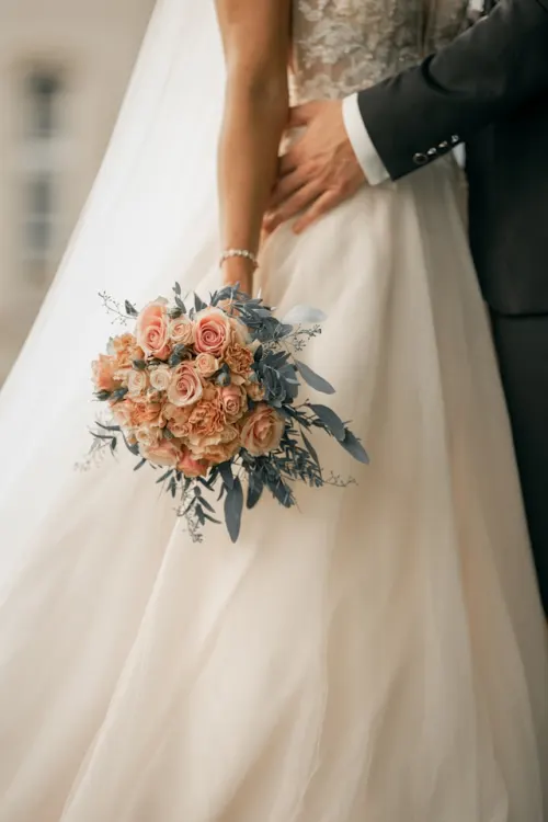 Pre-assembled boutonniere pinned on a groom's lapel